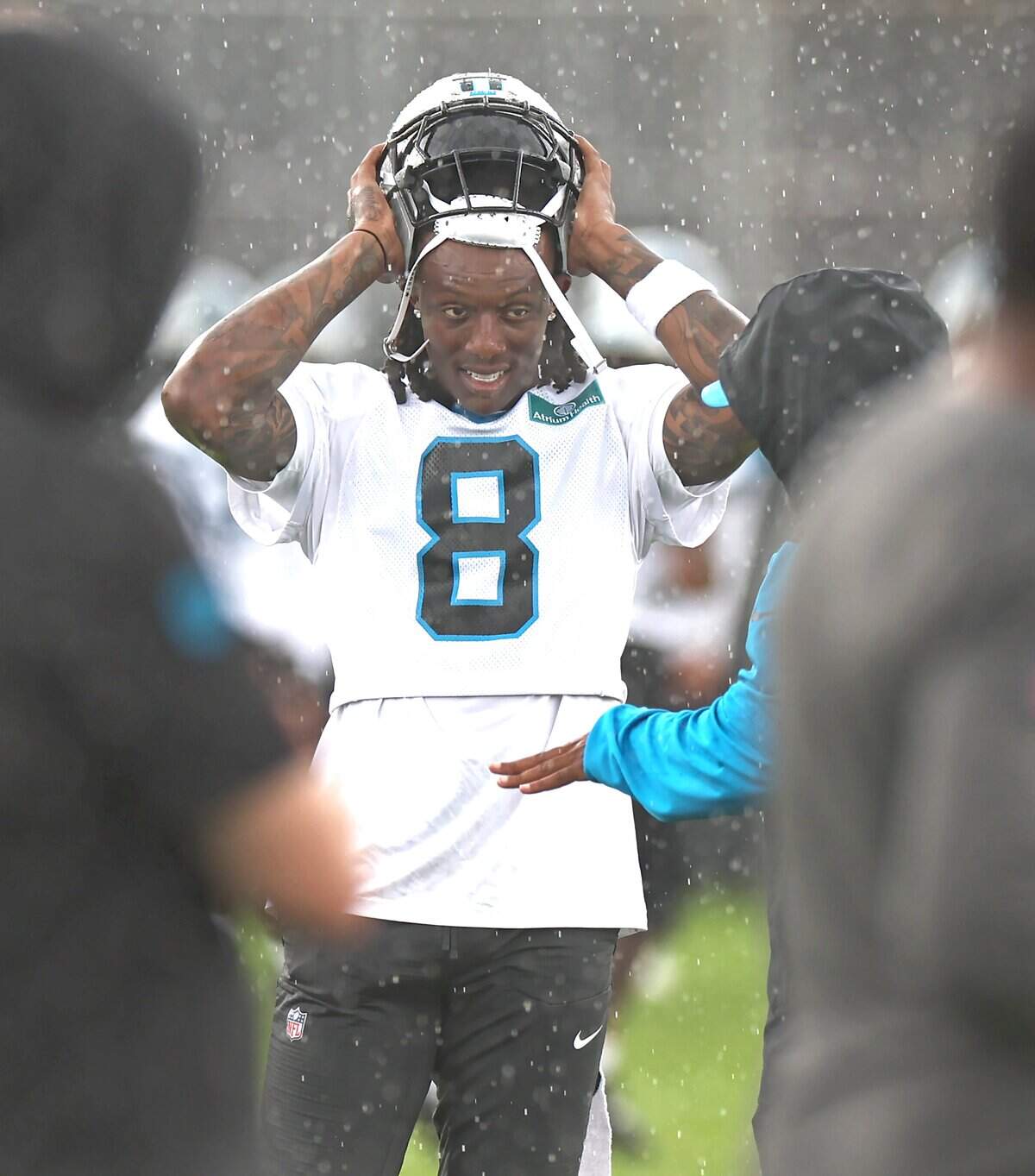 Carolina Panthers cornerback Jaycee Horn speaks with a member of the team's personnel during the team's first open workout on Tuesday, May 26, 2026.