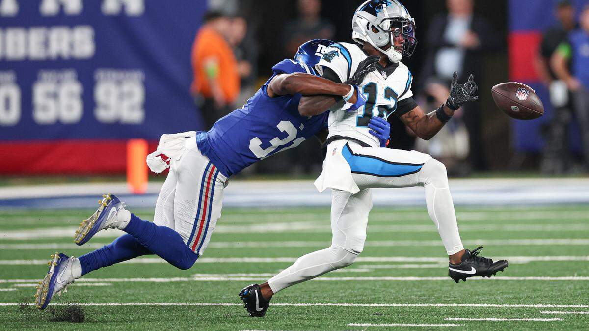 New York Giants safety Gervarrius Owens (31) breaks up a pass intended for Carolina Panthers wide receiver Shi Smith (12) during the first half at MetLife Stadium.