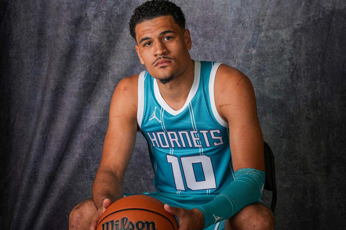 Charlotte Hornets guard Josh Green (10) poses for photos at Charlotte Hornets media day.