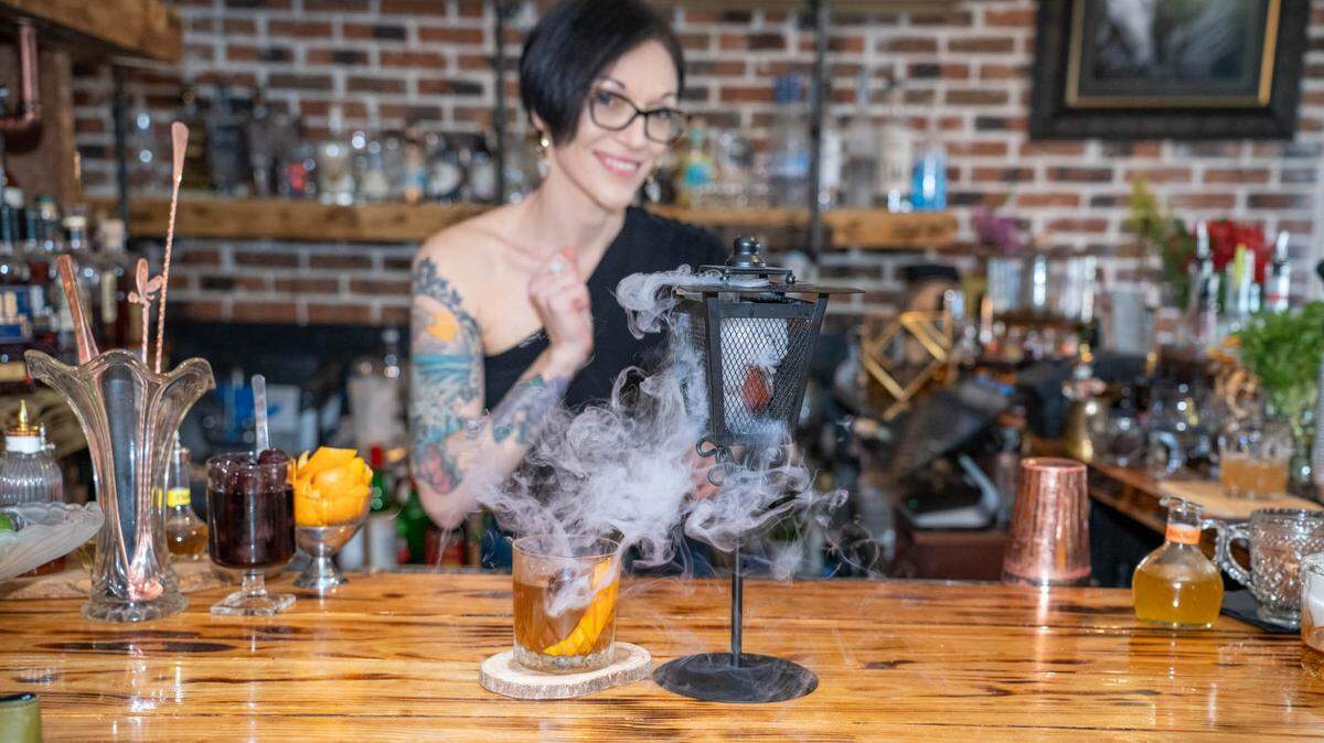 Bar Manager Dana Jordan keeps things smoky at Barrel & Fork in Cornelius.