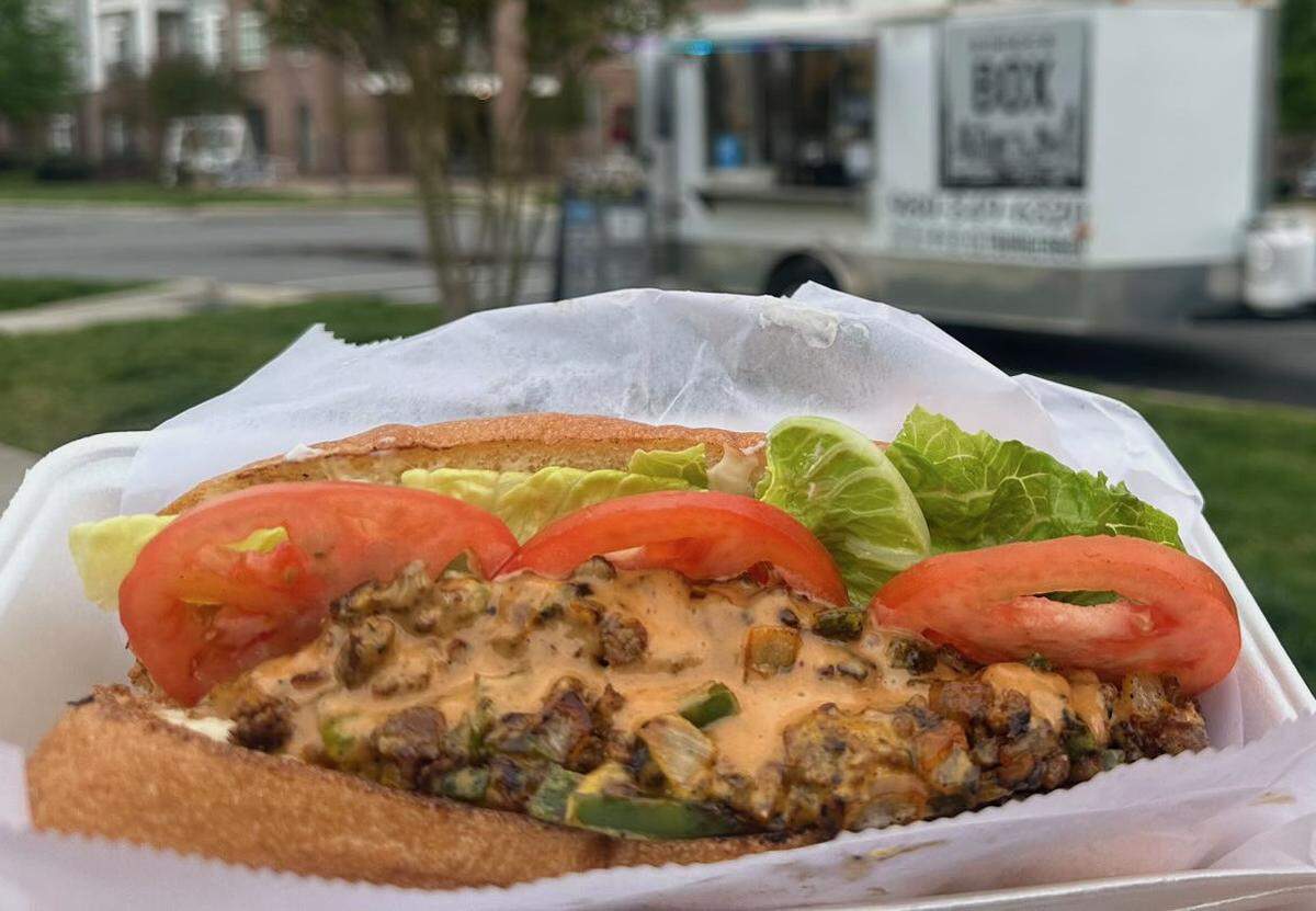 Burger Box’s CLT Chopped Cheese is packed with ground beef, grilled onions and peppers, and American cheese on a toasted hero roll with shredded lettuce, sliced tomatoes and Duke’s mayo.