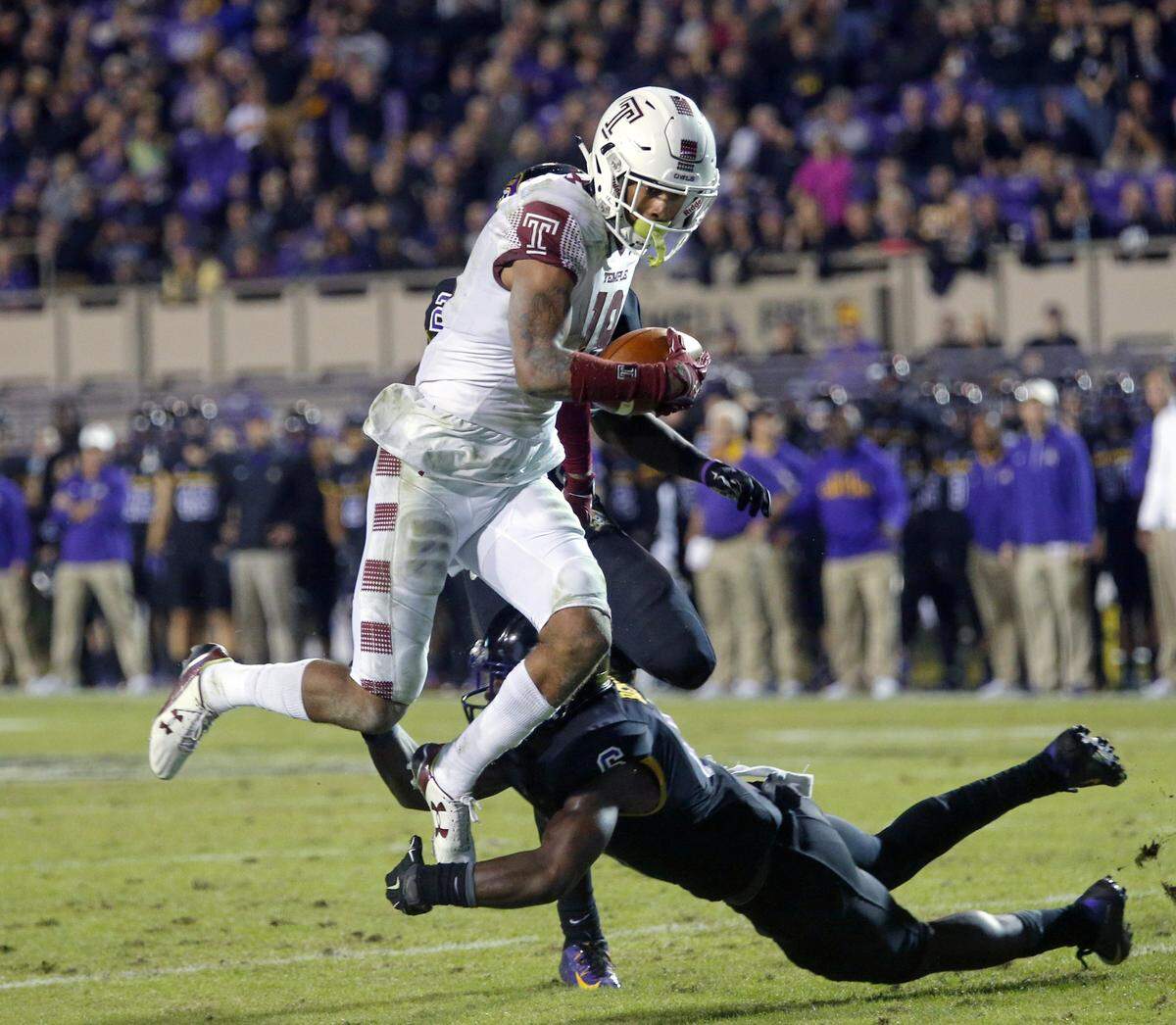 In 2015, Temple’s Robby Anderson (19) evaded a tackle by an East Carolina player to score the winning touchdown. Anderson was coached at the time by current Panthers head coach Matt Rhule, who had helped him return from academic suspension.