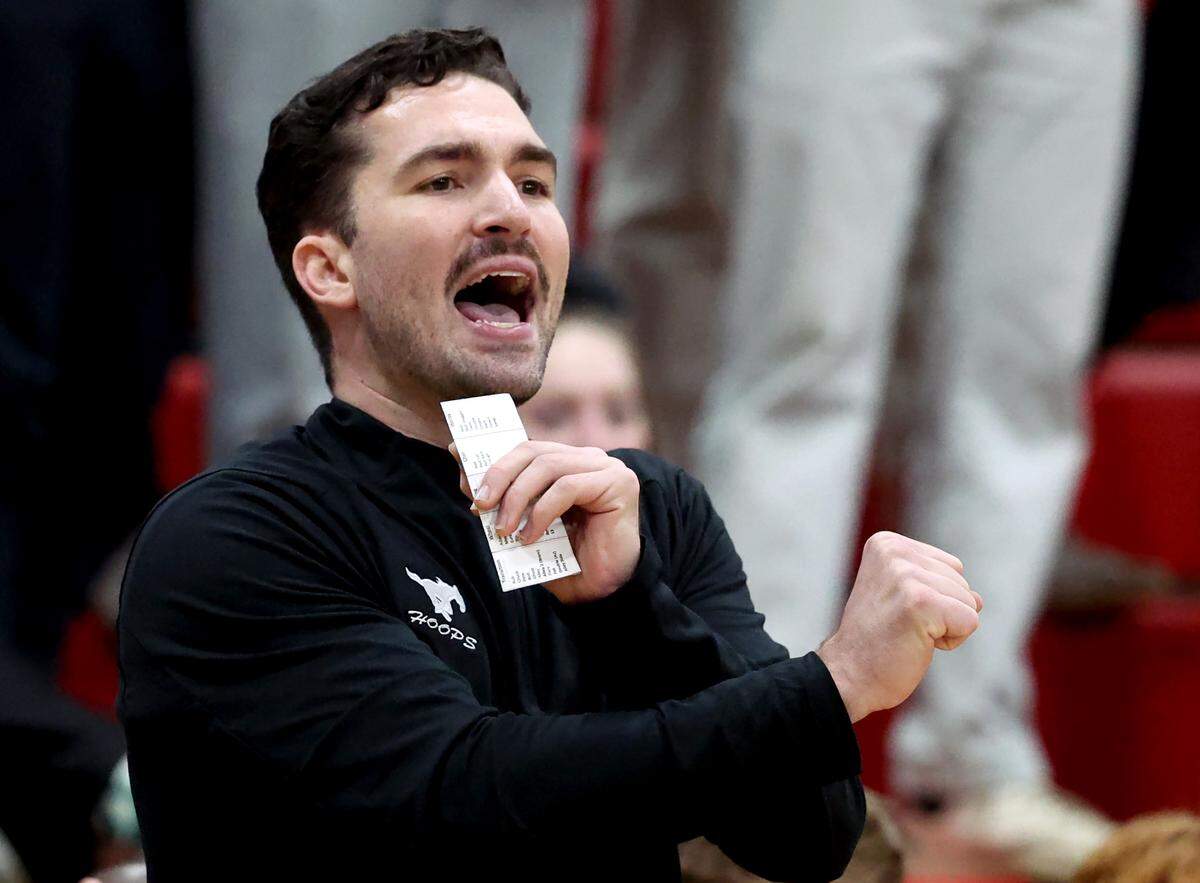 Myers Park head basketball coach Andrew Glover gives instructions to his team during action against South Meck on Friday, February 14, 2025. Myers Park defeated South Meck.