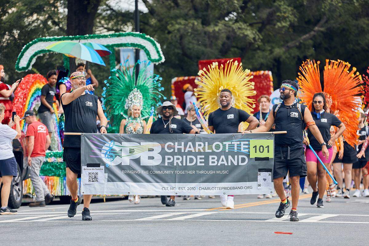 The Charlotte Pride Band takes center stage on North Tyron Street to open the festivities during the 25th Charlotte Pride Parade in uptown Charlotte on August 17, 2025.