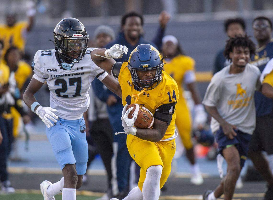 Johnson C. Smith’s Bobby Smith (14), broke off a long run in the fourth quarter Saturday. Livingstone’s Kah’mari Hill (27) forced Smith out of bounds on the play. The Golden Bulls won, 26-21.