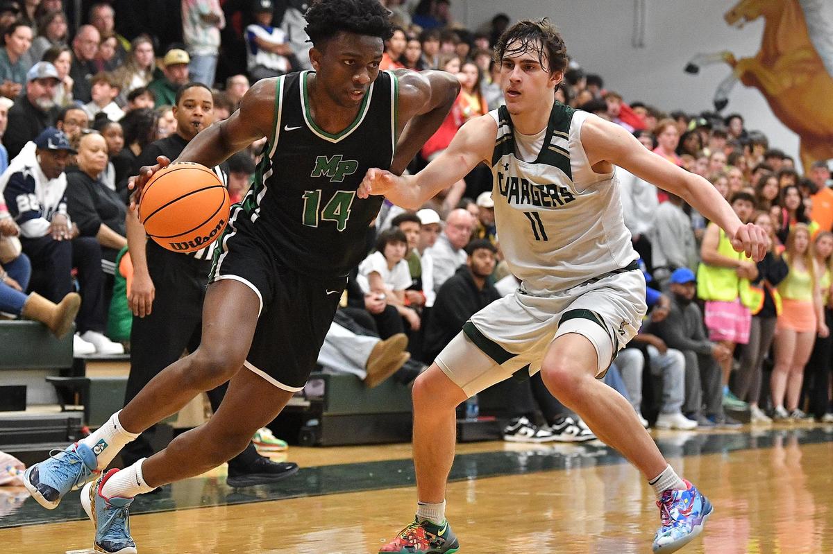 Myers Park;s Sir Mohammed (14) drives towards the lane against Northwood’s Beau Harvey (11) during the second half. The Northwood Chargers and the Myer Park Mustangs met in a non-conference game in Pittsboro, N.C. on January 13, 2024.