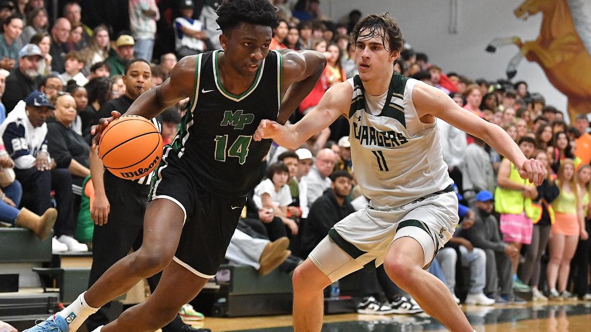 Myers Park;s Sir Mohammed (14) drives towards the lane against Northwood’s Beau Harvey (11) during the second half. The Northwood Chargers and the Myer Park Mustangs met in a non-conference game in Pittsboro, N.C. on January 13, 2024.
