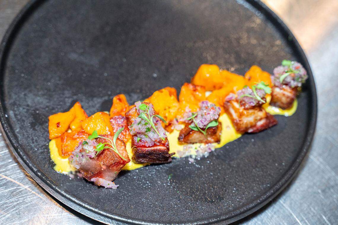Yunta’s chicharron is a small plate with crispy pork belly, diced sweet potato and chalaquita on top.