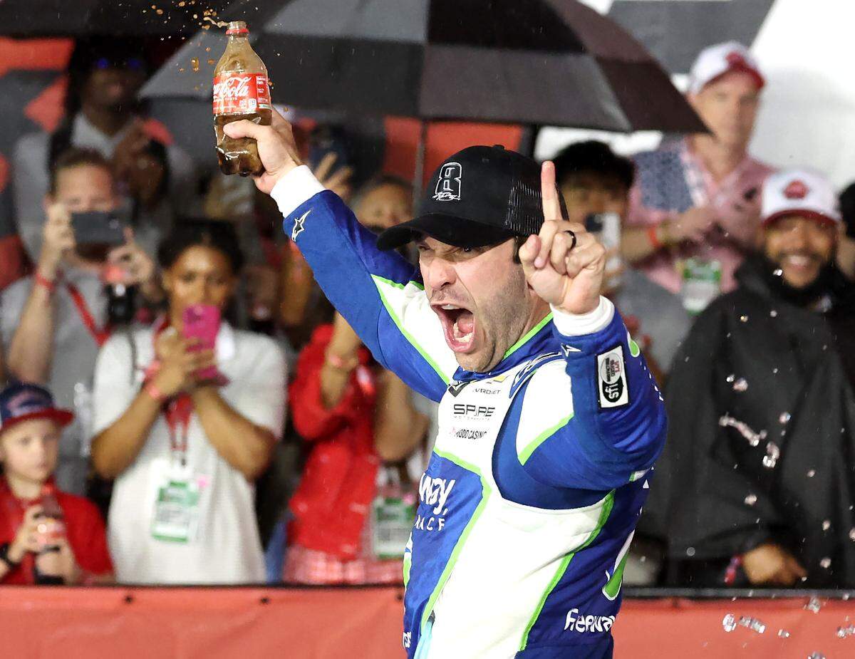 NASCAR driver Daniel Suarez celebrates winning the Coca-Cola 600 at Charlotte Motor Speedway in Concord, NC on Sunday, May 24, 2026. Suarez was declared the winner when the race was stopped due to rain.
