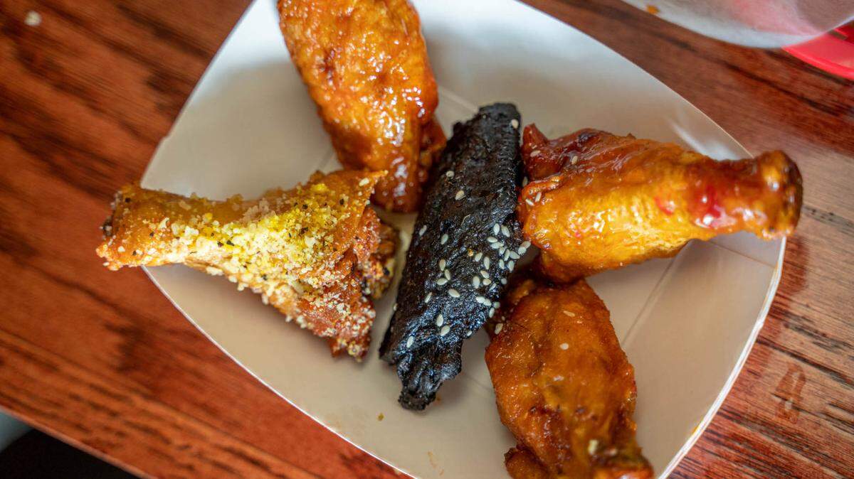 A variety of wings at Wing King Cafe in Charlotte. Ming Wings in the middle, and clockwise: sweet chili, honey hot, garlic lemon pepper and traditional buffalo.