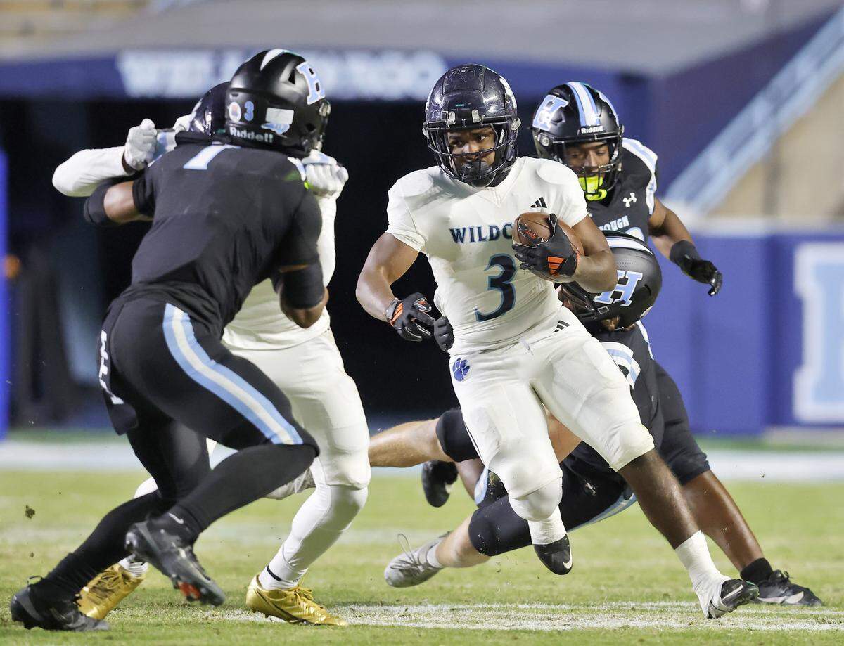 Millbrook’s Brilison McCullers runs the ball during the first half of the NCHSAA 8A high school football state final against Hough on Thursday, Dec. 11, 2025, at Kenan Stadium in Chapel Hill, N.C. 