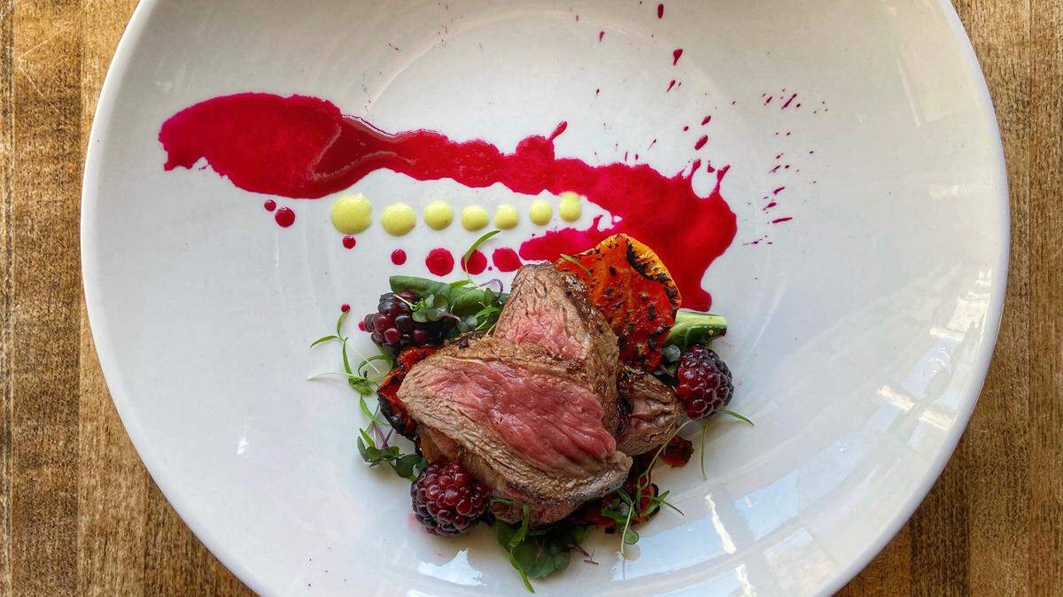 Aged elk tenderloin with smoked prickly pear sauce.