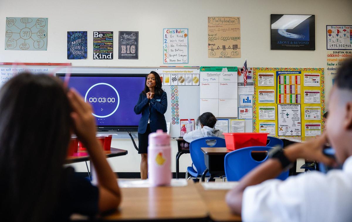 CMS Superintendent Dr. Crystal Hill greets third-grade students during the first day of school at Idlewild Elementary School in Charlotte, NC on Monday, August 26, 2024.