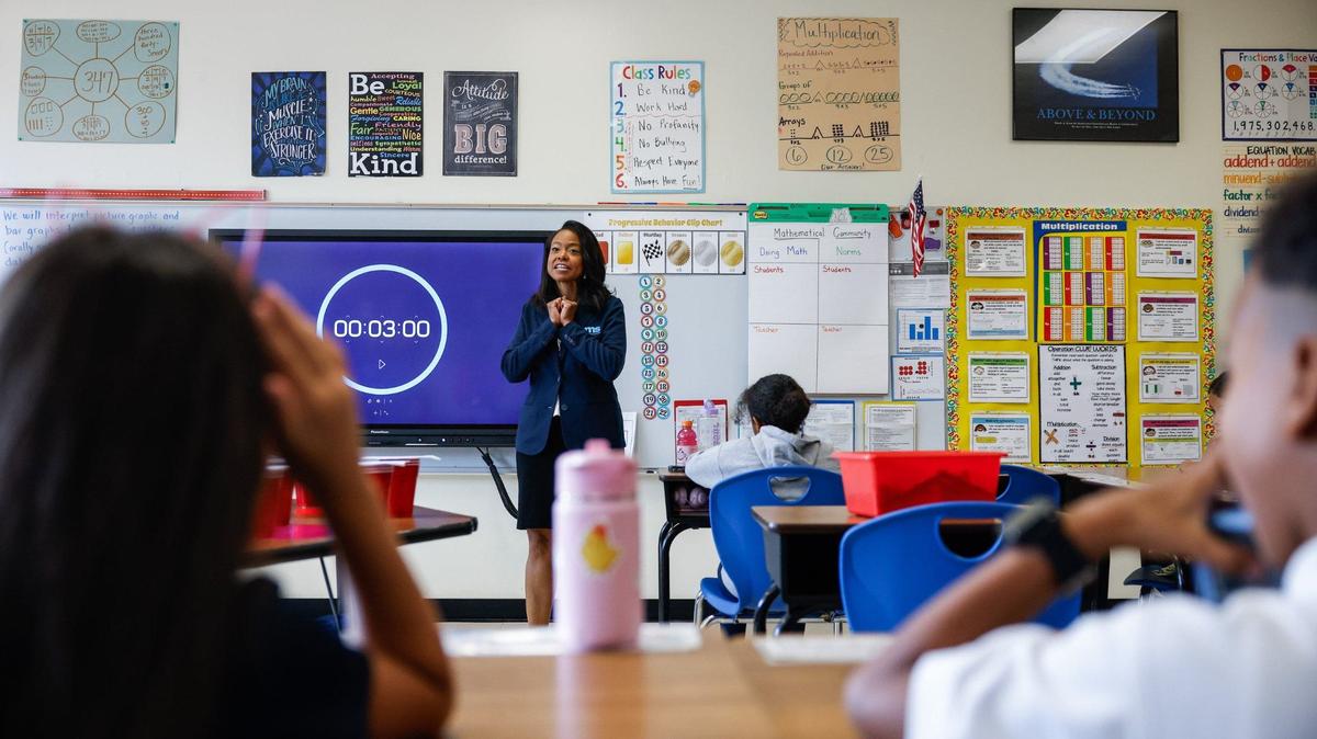 CMS Superintendent Dr. Crystal Hill greets third-grade students during the first day of school at Idlewild Elementary School in Charlotte, NC on Monday, August 26, 2024.