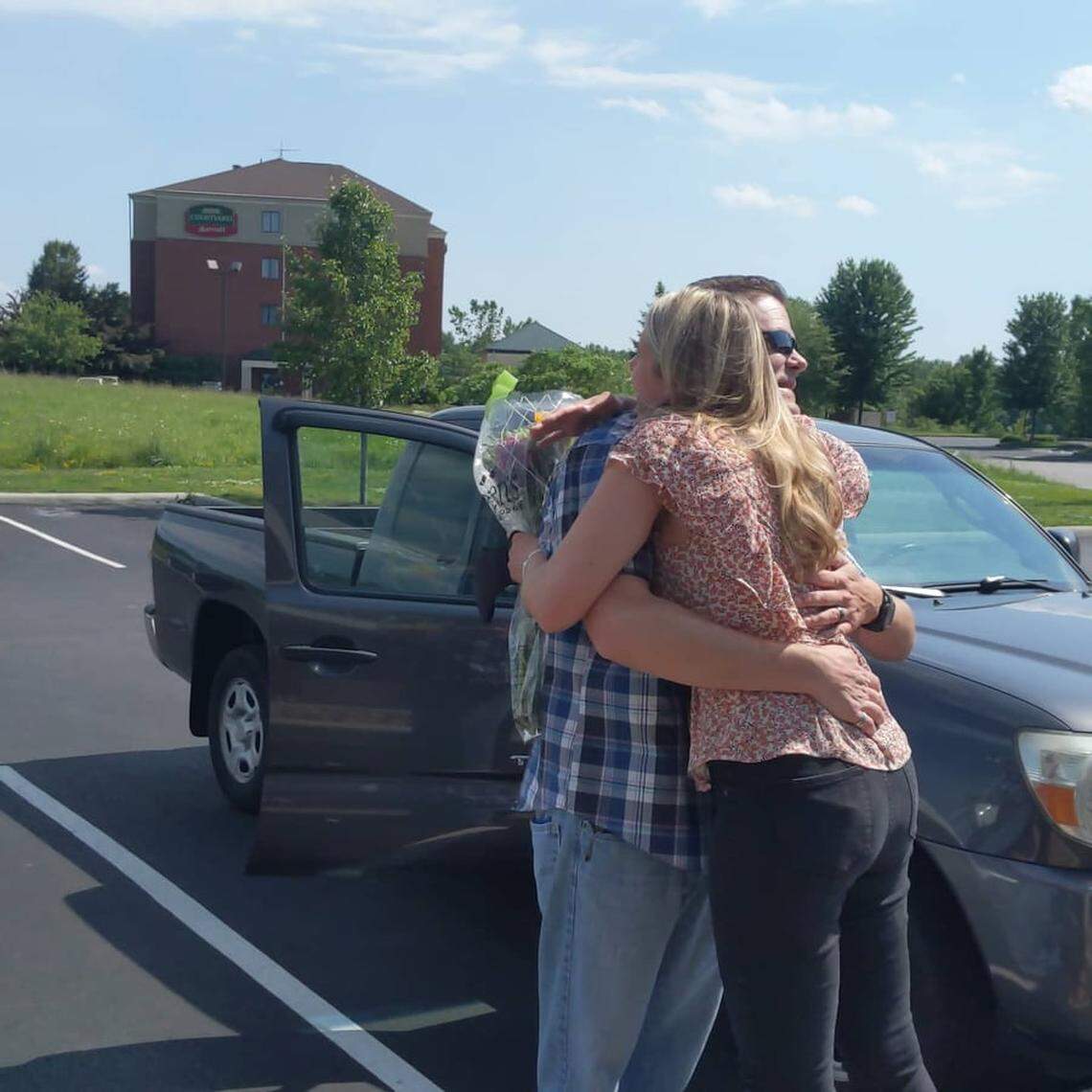 Ryan Krok and Natalie Friedl embrace upon seeing each other for the first time in 20 years.