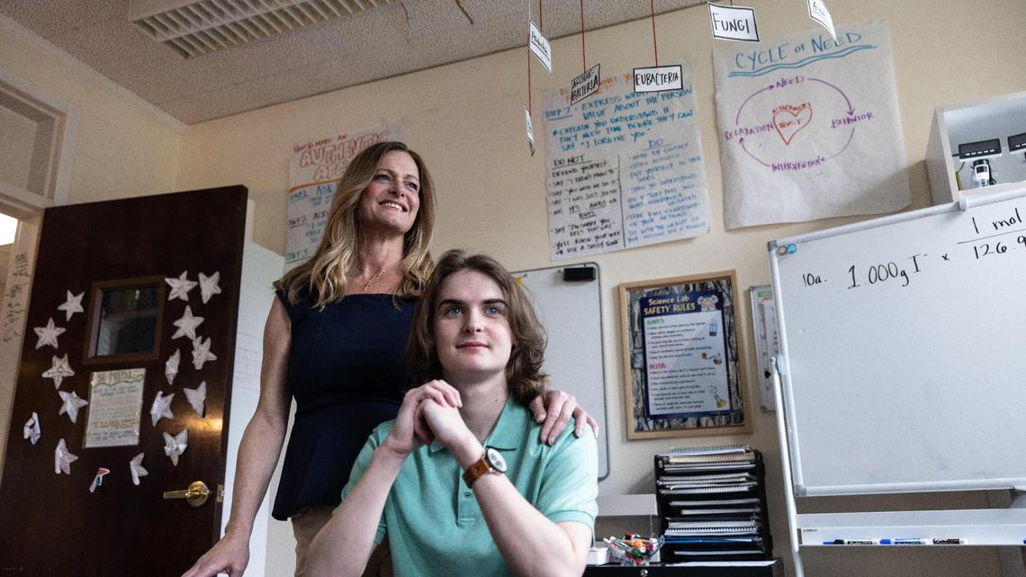 Tommy Norris, right, poses for a portrait with his mom, Bridget, at Emerald School of Excellence in Charlotte, N.C., on Friday, March 31, 2023.