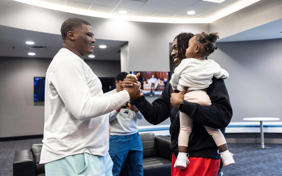 Carolina Panthers Derrick Brown surprises Monroe High football star Jordan Young with an invitation to Nike’s “The Next Ones” camp in the locker room at the Bank Of America Stadium in Charlotte, N.C., on Friday, January 26, 2024.