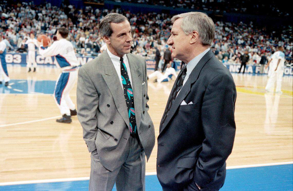Kansas coach Roy Williams, left, talks with his mentor UNC coach Dean Smith before their two teams met in the 1993 National Championship semifinal game in New Orleans. UNC came out on top and went on to defeat Michigan to win the National Championship.