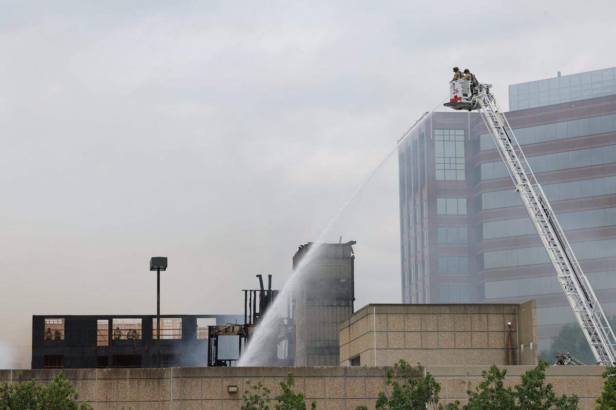 Firefighters working the scene of a massive fire spread across at least two structures and threatened others in Charlotte’s South Park neighborhood May 18, 2023