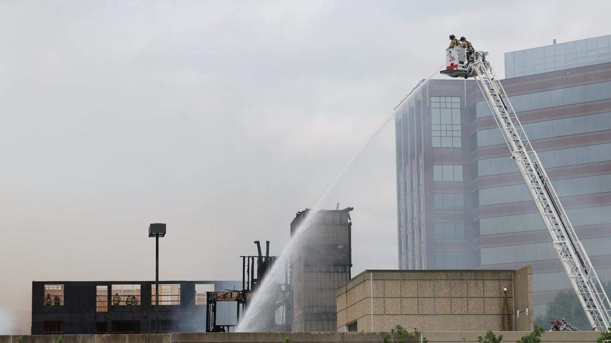 Firefighters continue working the scene of a massive fire spread across at least two structures and threatened others in Charlotte’s South Park neighborhood Thursday morning, May 18, 2023