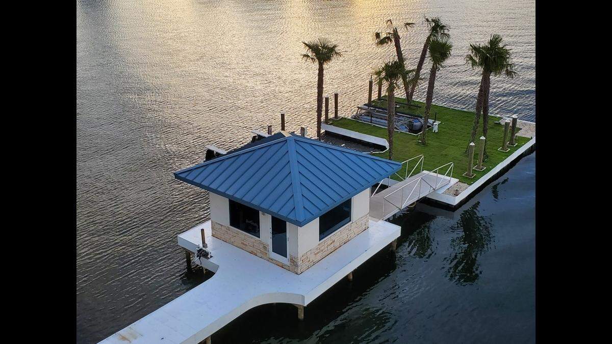 Ted and Beverly Corriher’s Lake Norman mansion includes this 2,400-square-foot dock with palm trees.