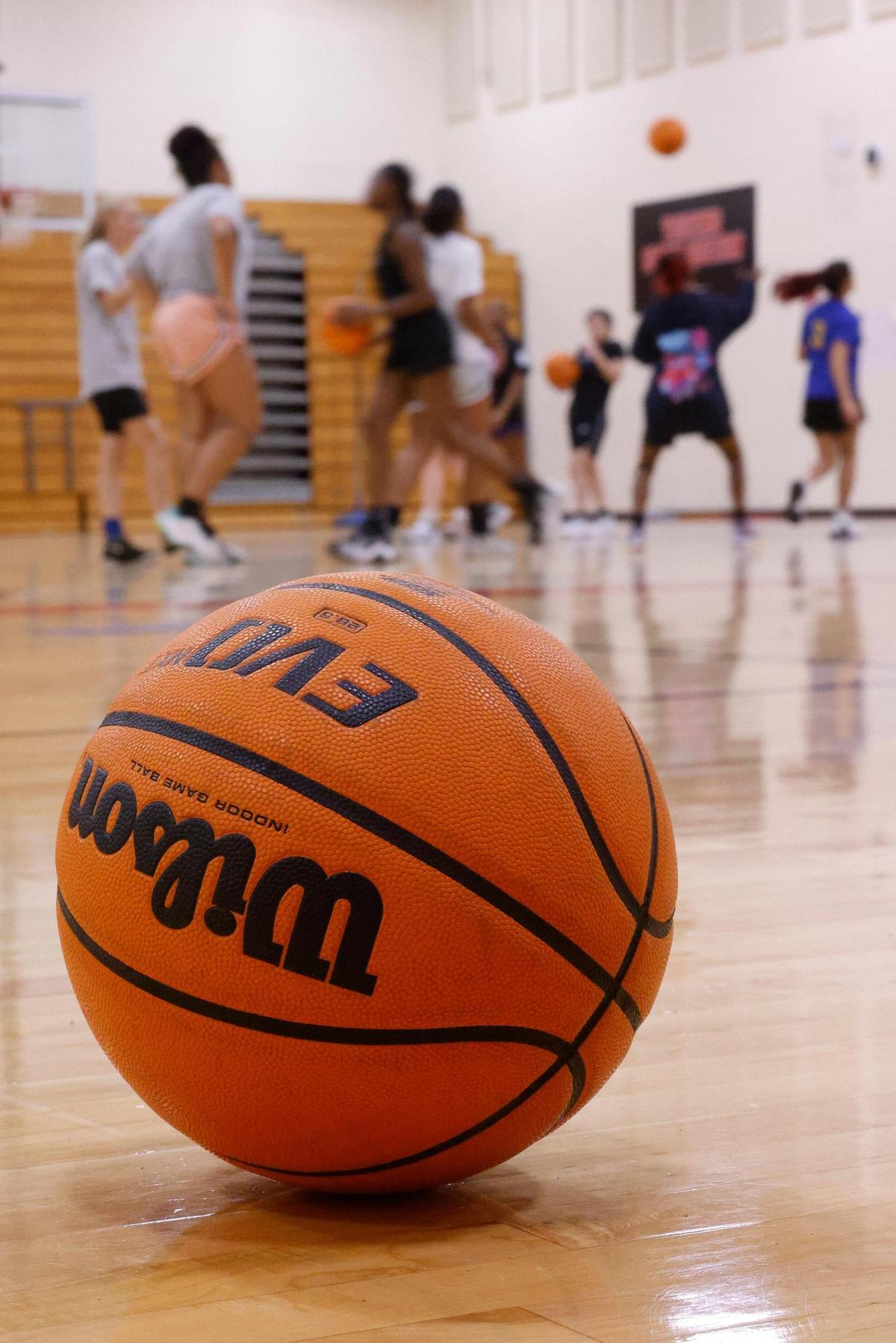 A basketball sits on the court during girls basketball practice at Butler High School in Charlotte, N.C., Tuesday, Oct. 25, 2022.