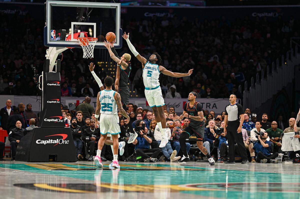 Nov 10, 2023; Washington, District of Columbia, USA; \hh33\ shoots as Charlotte Hornets center Mark Williams (5) defends during the second half at Capital One Arena.