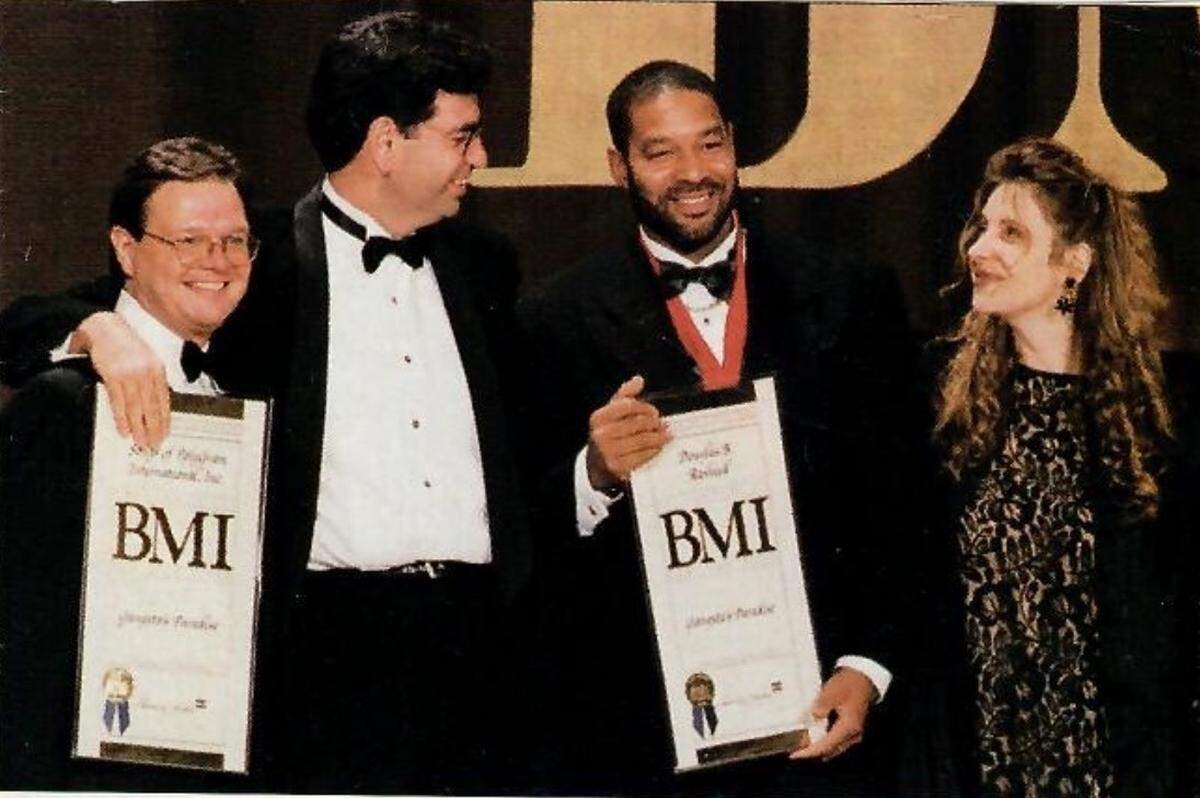 Doug Rasheed, second from right, collecting a BMI Award for “Gangsta’s Paradise” in 1997.