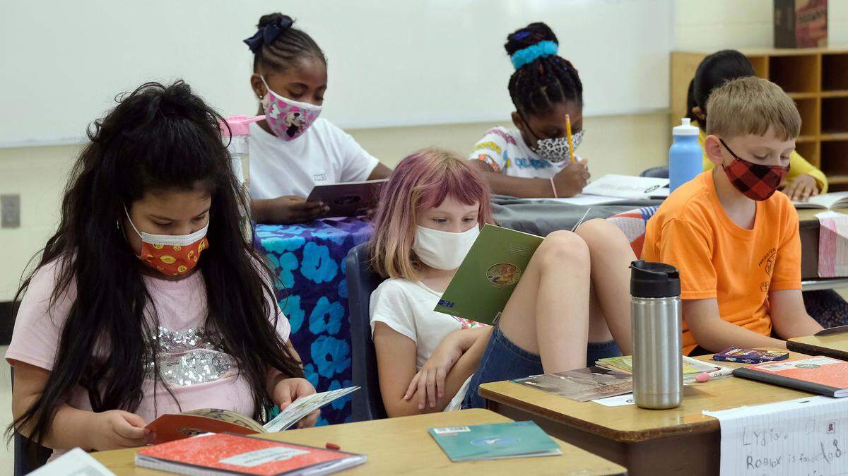 In this June 17, 2021 photo provided by Charlotte-Mecklenburg Schools, second-grade students at McAlpine Elementary School take part in the classroom learning portion of Camp CMS. The summer program was designed to help students make up for COVID-19 disruptions.