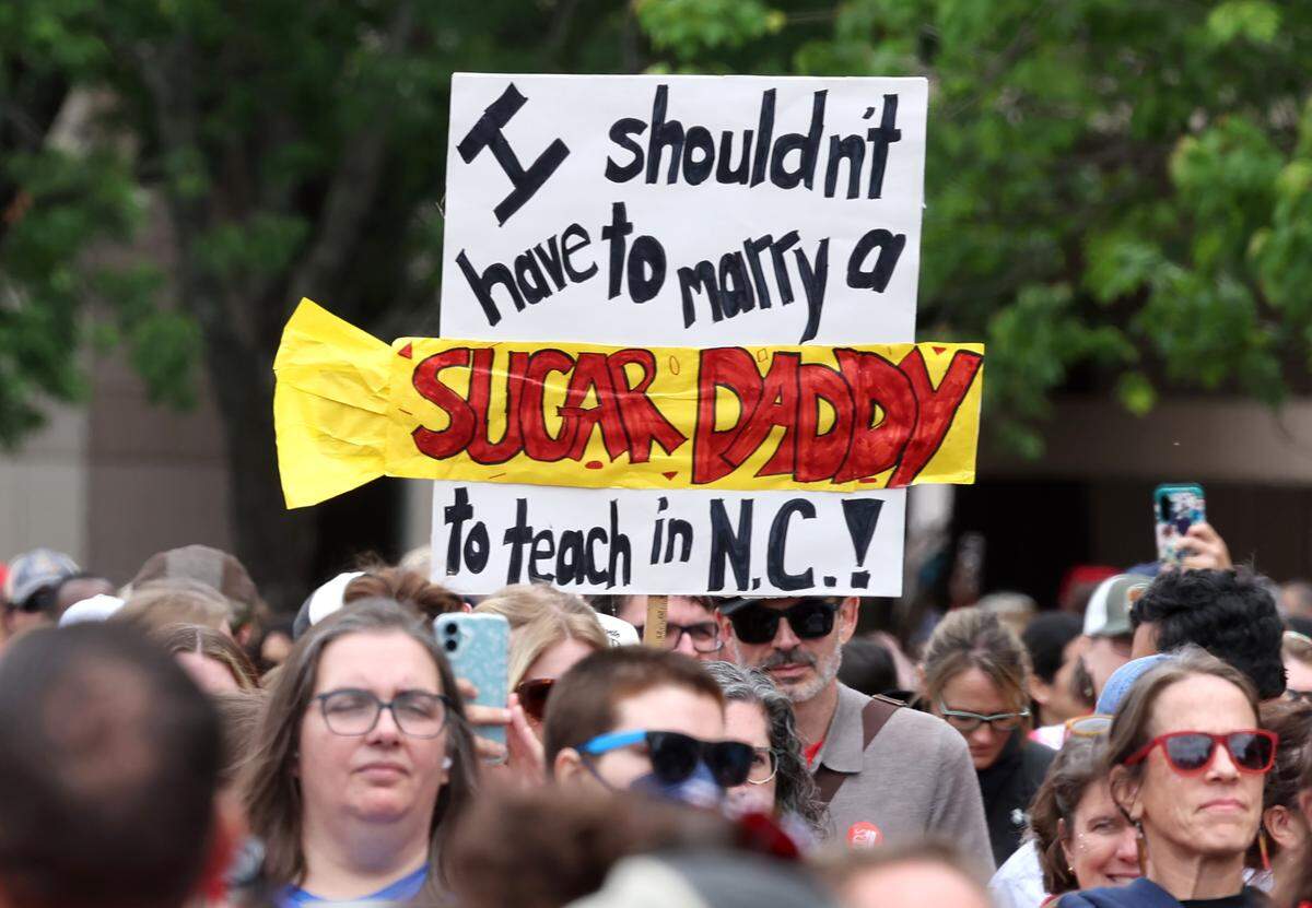 Signs, signs, signs were everywhere as teachers rallied at the Government Complex in Raleigh.