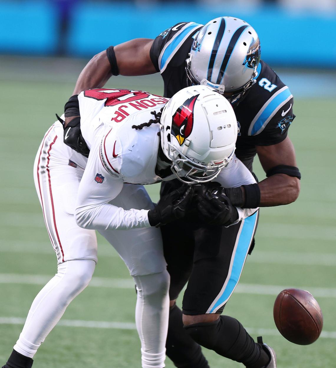 Carolina Panthers cornerback Mike Jackson, right, knocks the ball away from Arizona Cardinals wide receiver Marvin Harrison Jr., left, during action at Bank of America Stadium in Charlotte, NC on Sunday, December 22, 2024. The Panthers defeated the Cardinals 36-30 in overtime.