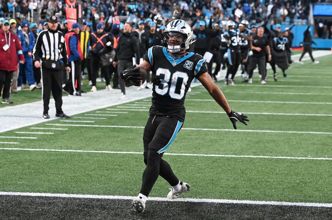 Carolina Panthers running back Chuba Hubbard high-steps into the end zone for the game-winning touchdown against the Arizona Cardinals at Bank of America Stadium in Charlotte, NC on Sunday, December 22, 2024. The Panthers defeated the Cardinals in overtime, 36-30, as Hubbard rushed for 152 yards.