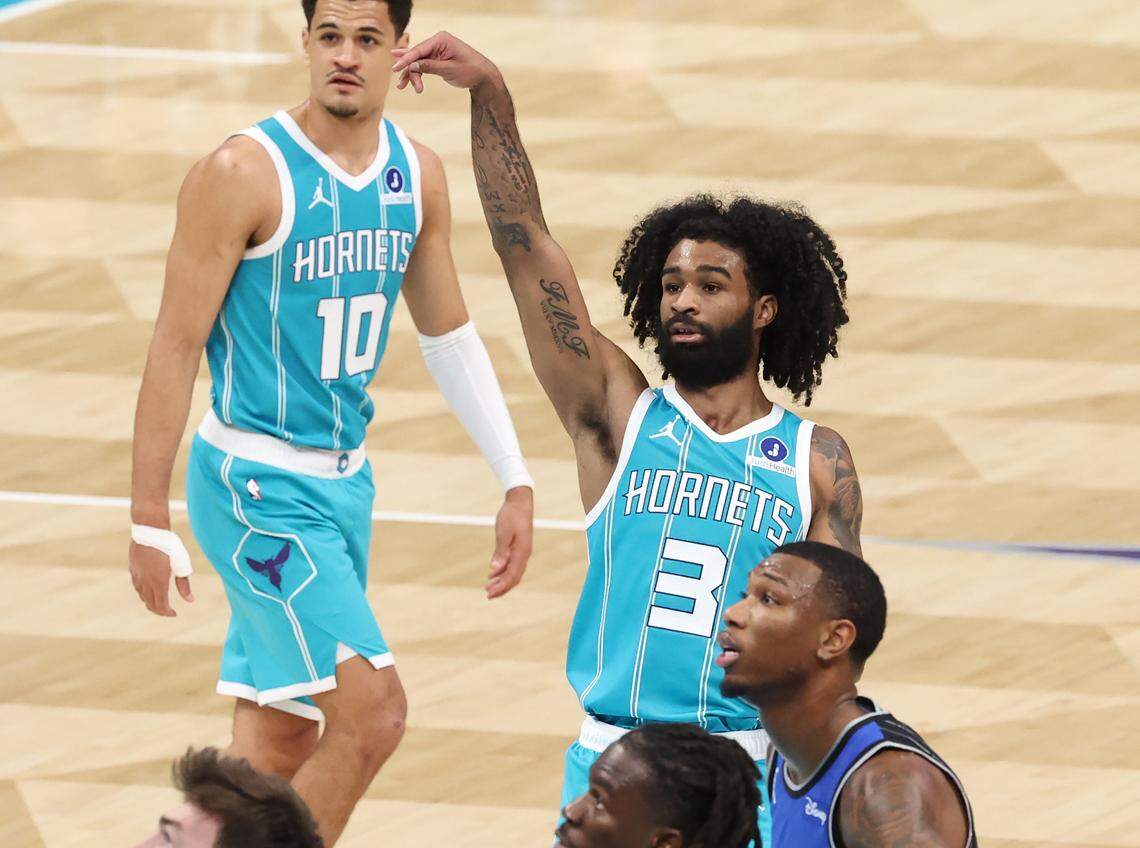 Charlotte Hornets guard Coby White holds his release on a free throw against the Orlando Magic at Spectrum Center on March 19.