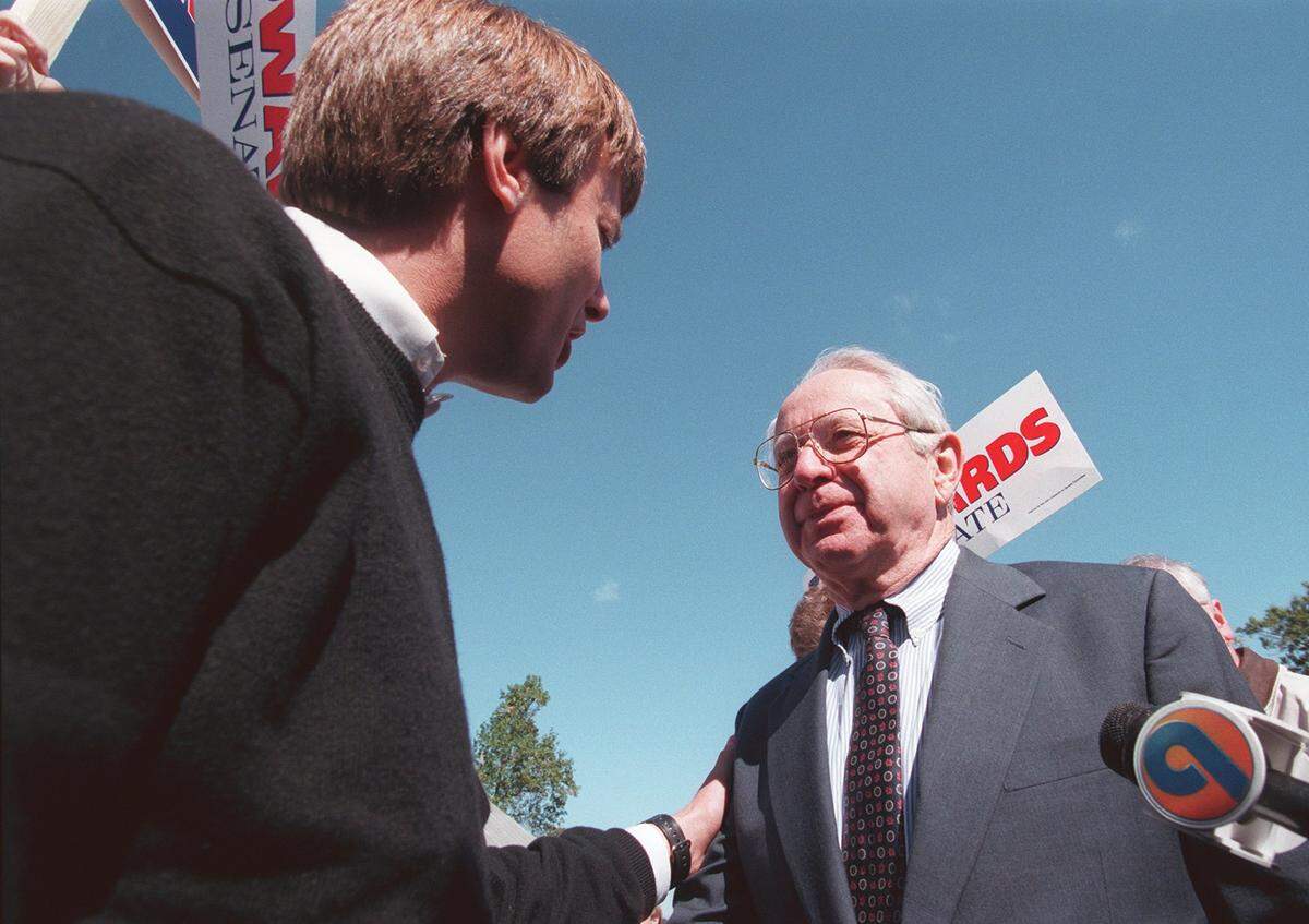 Democratic challenger John Edwards meets Republican Senator Lauch Faircloth at the Mallard Creek Barbecue Thursday afternoon, Oct. 22, 1998.