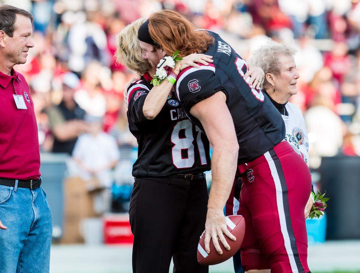 South Carolina Gamecocks tight end Hayden Hurst (81) hugs his family during Senior Day festivities. Hurst is a junior but is expected to enter the NFL draft.