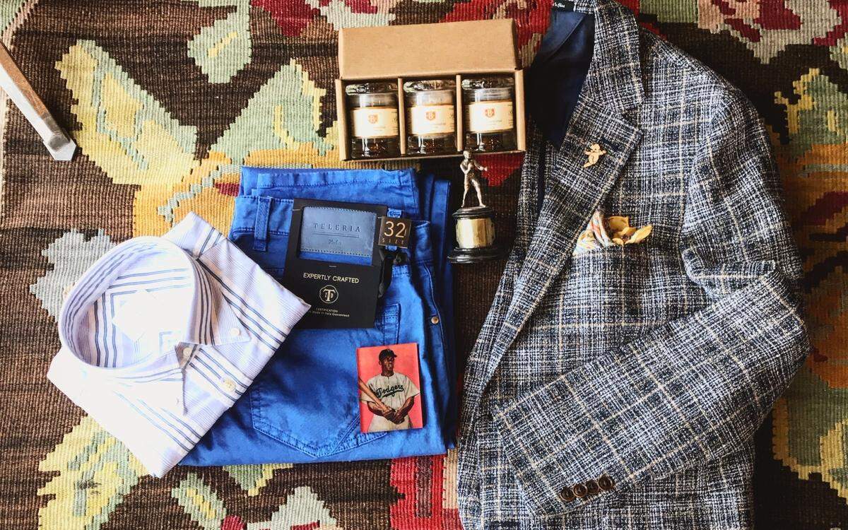 Clothing and gifts from Bruce Julian Clothier that dad is sure to love. From left: shirt by Forrest Leonnard ($197.50), Italian jeans by Teleria ($225), Jackie Robinson magnet ($20), smoked finishing salt set by Bitterman Salt Company ($40), antique boxing trophy ($280), sport coat ($450), baby lapel bin ($16), pocket square ($39.50).  