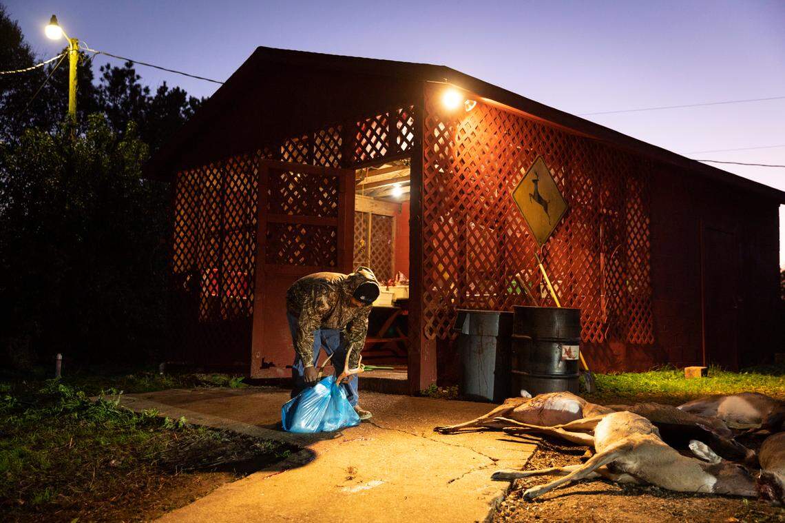 Scottie Spencer bags the head of a deer after it was processed at Pearce’s Custom Processing on Nov. 9, 2019.