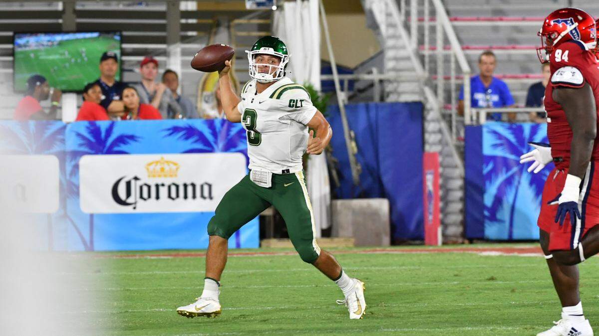 Charlotte 49ers quarterback Chris Reynolds drops back to pass against Florida Atlantic during the teams’ game in Coral Gables, Florida on Saturday, August 27, 2022. Reynolds tossed two touchdowns in the game to Grant DuBose, but the 49ers fell, 43-13.