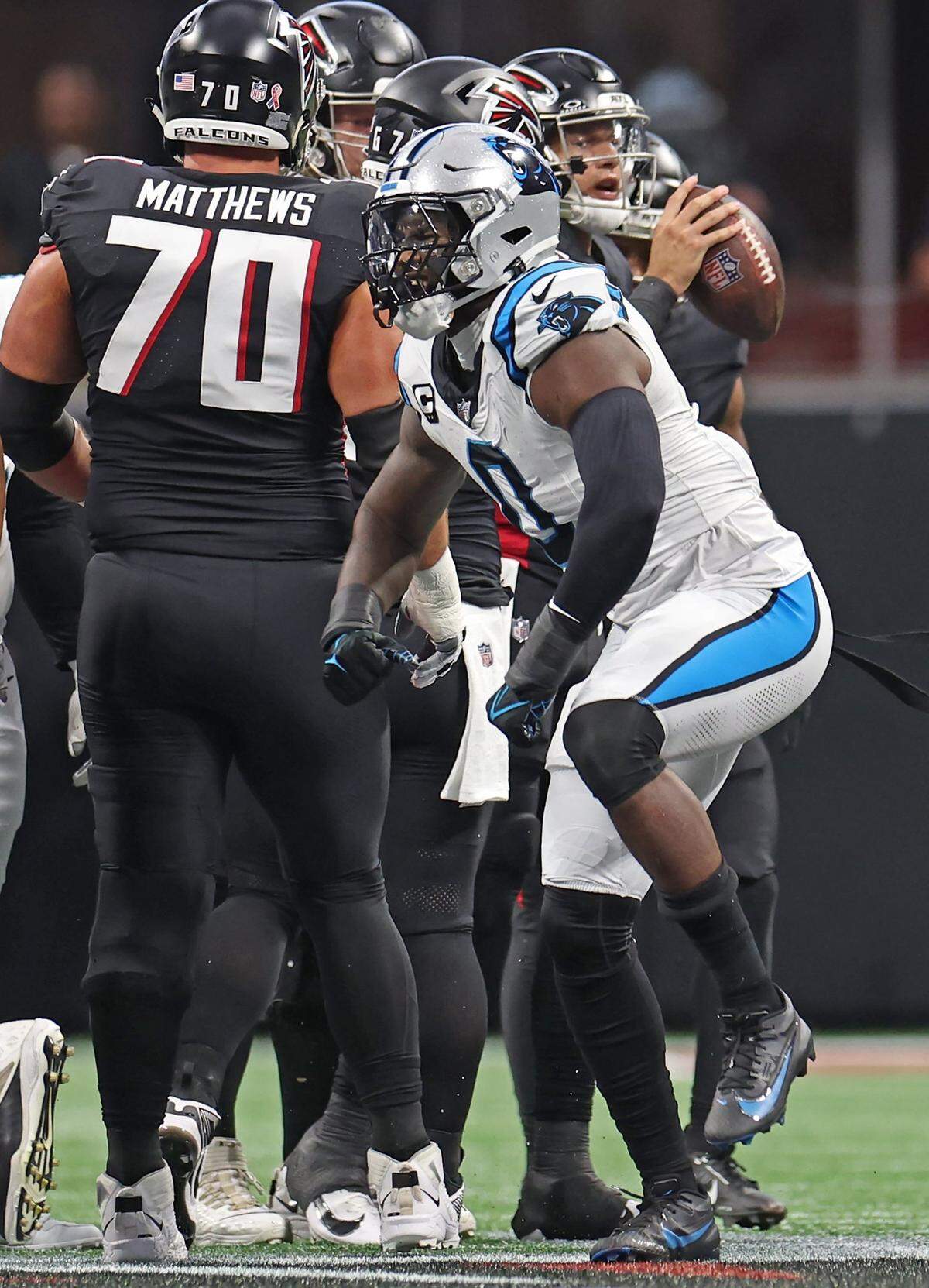 Carolina Panthers linebacker Brian Burns celebrates a play against the Atlanta Falcons during first-quarter action at Mercedes-Benz Stadium in Atlanta, GA on Sunday, September 10, 2023.