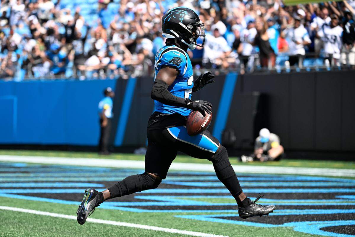 Carolina Panthers cornerback Chau Smith-Wade (26) scores a touchdown after intercepting the ball in Sunday’s third quarter at Bank of America Stadium. 