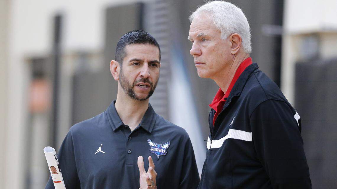 Charlotte Hornets coach James Borrego (left), confers with general manager Mitch Kupchak during draft preparations. A minicamp next week precedes the Las Vegas summer league.