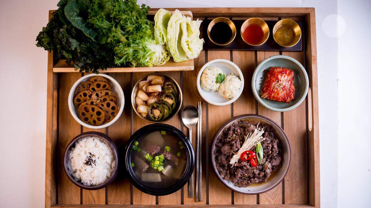 The Ssam platter with beef bulgogi on MOA’s specialty menu includes the chef’s choice of four banchan sides and a choice of kimchi stew or beef and radish soup, with white rice and lettuce wraps for $32.