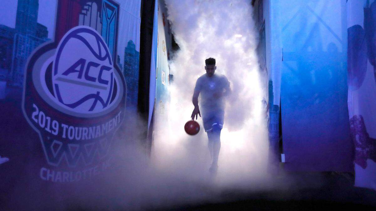 Duke’s Javin DeLaurier (12) leads the team onto the court before Duke’s game against UNC in the semifinals of the 2019 ACC Tournament in Charlotte, N.C., Friday, March 15, 2019.