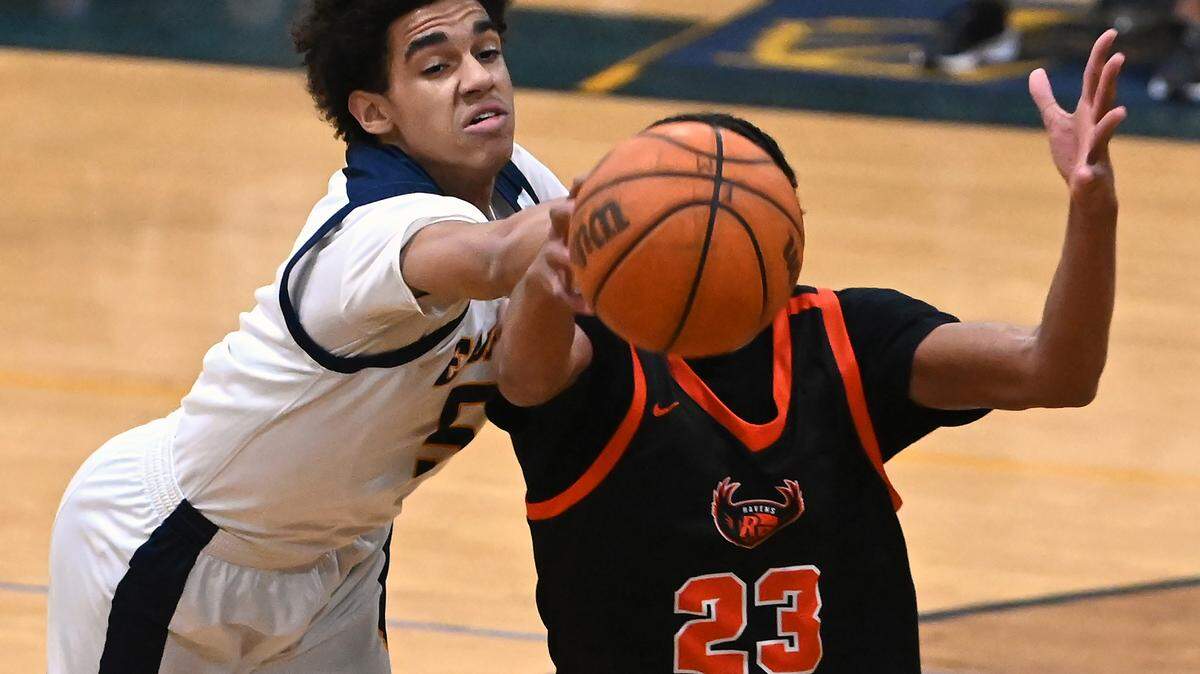 East Meck’s Jordan Buzzard, left, knocks the ball away from Rocky River’s Brian Car, right, during action on Friday, January 26, 2024 at East Meck High. Rocky River defeated East Meck 66-57.