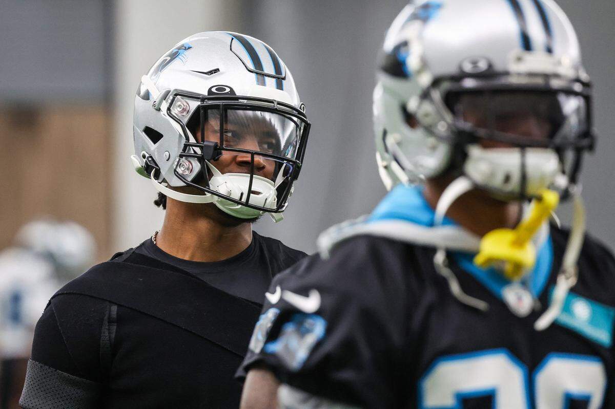 Panthers cornerback CJ Henderson, left, during the stretch period on day two of mini camp on Wednesday, June 15, 2022 in Charlotte, NC.