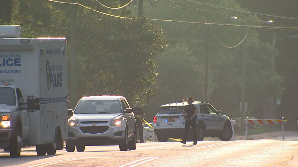 Police on Saturday, Aug. 3, 2024, at the scene of a shooting that killed a person and injured three others on Shamrock Drive in east Charlotte.