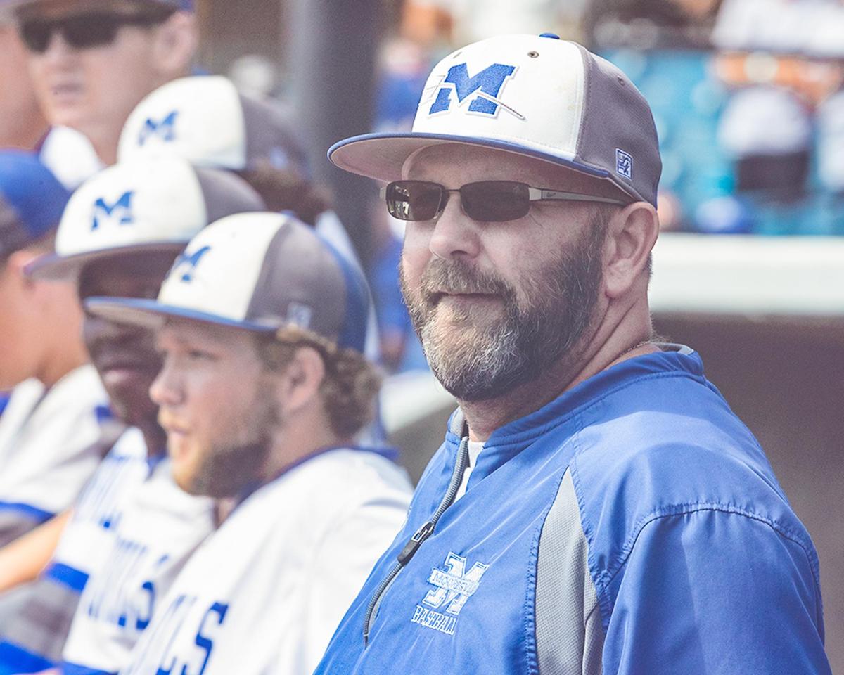 Mooresville head coach,  Jeff Burchette, looks on as hit team would give up two runs in the 1st inning of game 1.