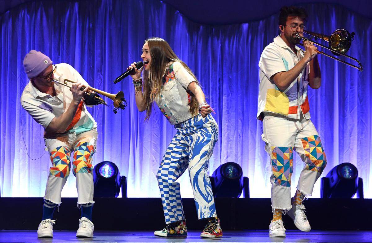 Contemporary Christian music singer Lauren Daigle, center, performs with members of her band during her Kaleidoscope Tour at Spectrum Center in Charlotte, NC on Thursday, February 22, 2024.