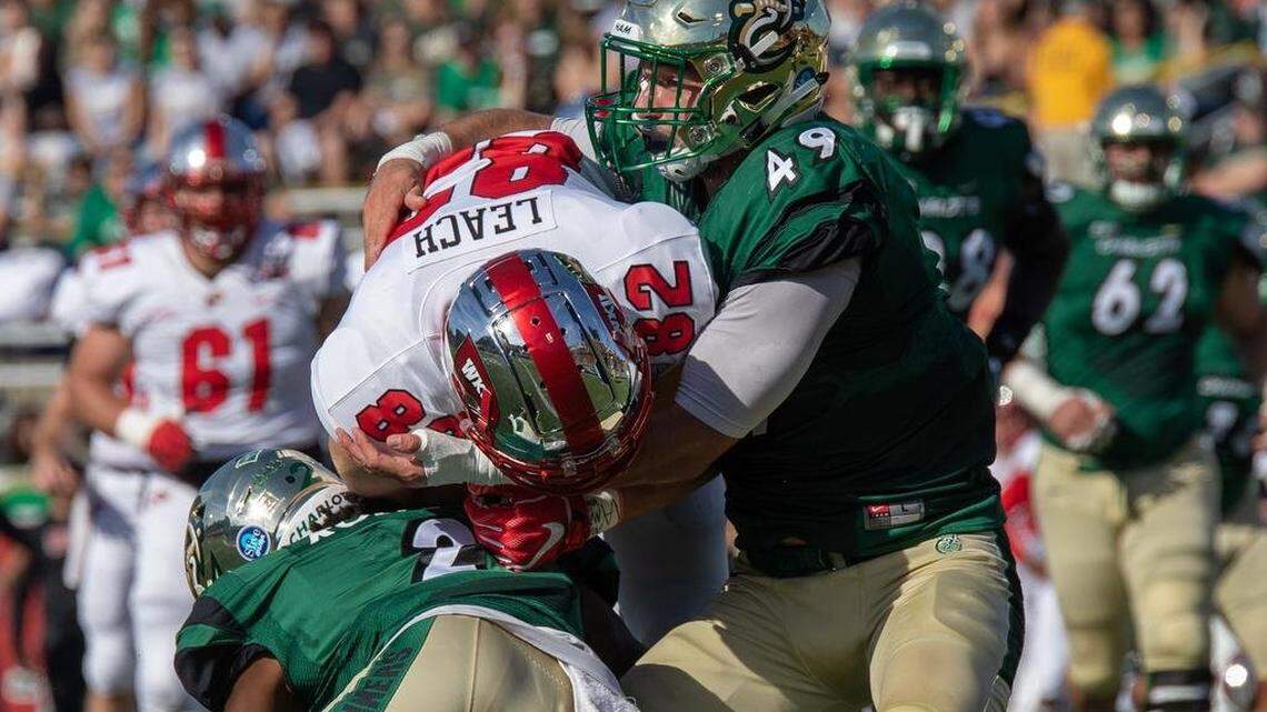 Wearing #49 this game Jeff Gemmell tages down WKU #82 Kris Leach. WKU vs Charlotte 49ers football, Saturday October 13th, 2018
