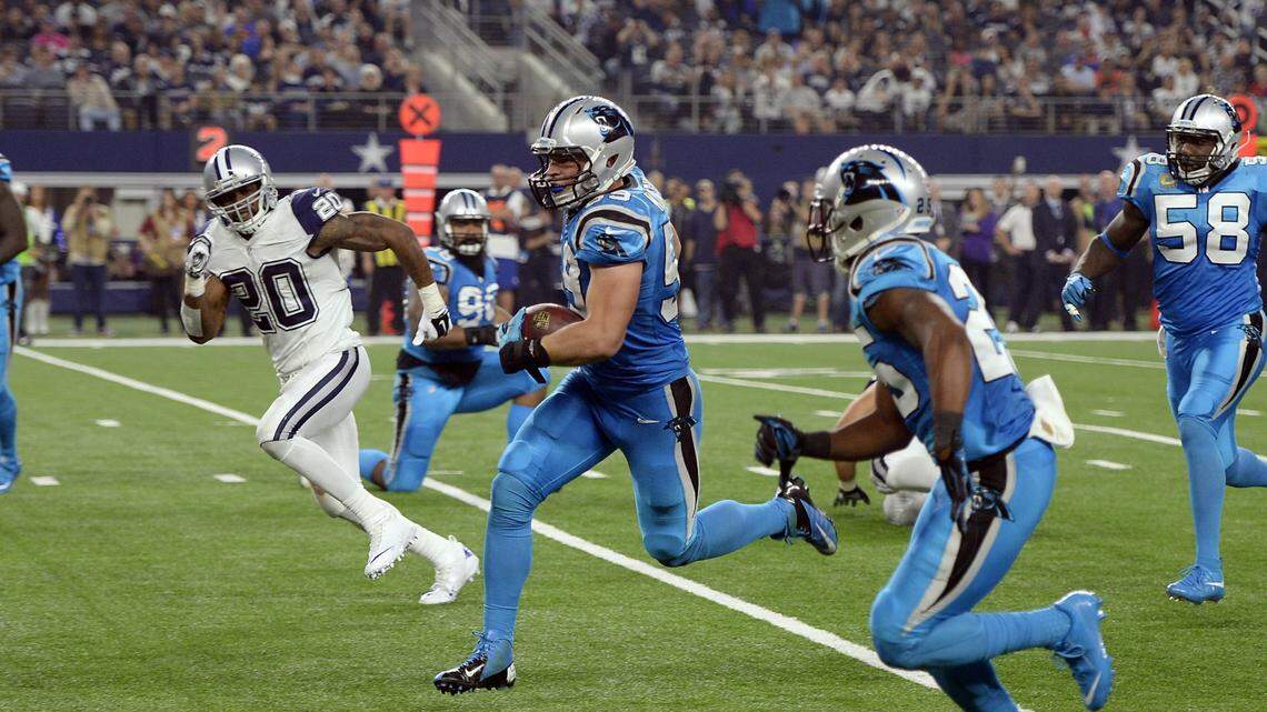 Carolina linebacker Luke Kuechly (59) heads toward the end zone after intercepting a pass by Dallas Cowboys QB Tony Romo on Nov. 26, 2015. The Panthers won, 33-14, in what was their last road trip to play the Cowboys until Sunday.